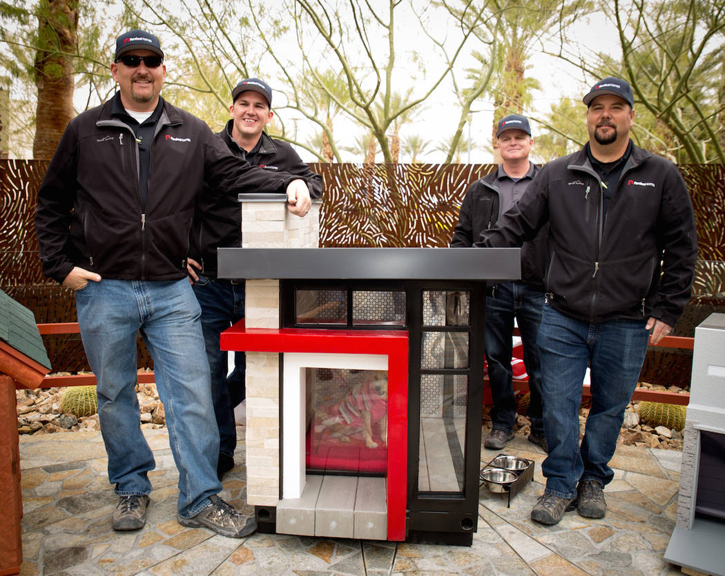 From left, Adam Gregg, Dustin Ellis, Kent Hall and Erich Pfaffinger of Pardee Homes pose with the doghouse they built to help raise money for HomeAid of Southern Nevada.