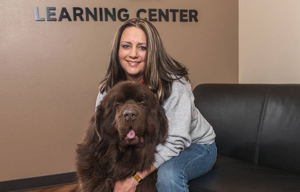 Emily Smith, executive director of the Nevada Blind Children’s Foundation, with her dog, Buddy.