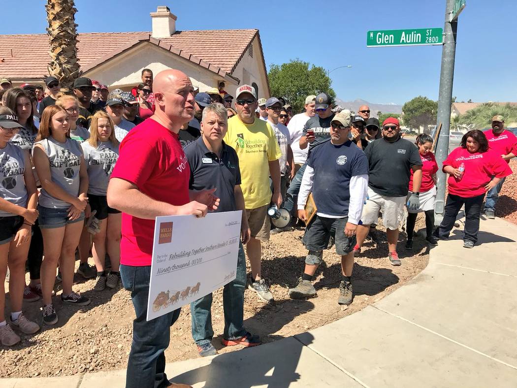 Wells Fargo Bank presented Rebuilding Together Southern Nevada a grant for $90,000 for affordable veteran housing in Las Vegas. Presenting the grant is Wells Fargo Nevada Southern Region Bank Pres ...