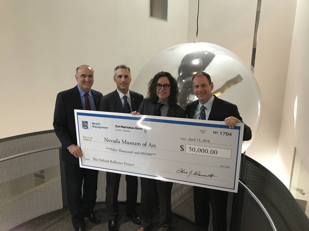 Executives from City National and RBC Wealth Management present David Walker, right center from the Nevada Museum of Art with $50,000 for its support of the Orbital Reflector project. (Nevada Muse ...