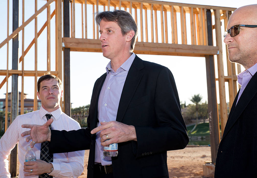 Architect Michael Wetzel, center, talks to and Kit Gallup, left, and Luxury Realtor Ivan Sher, right, about the showcase home under construction in Lake Las Vegas. (Tonya Harvey Las Vegas Business ...