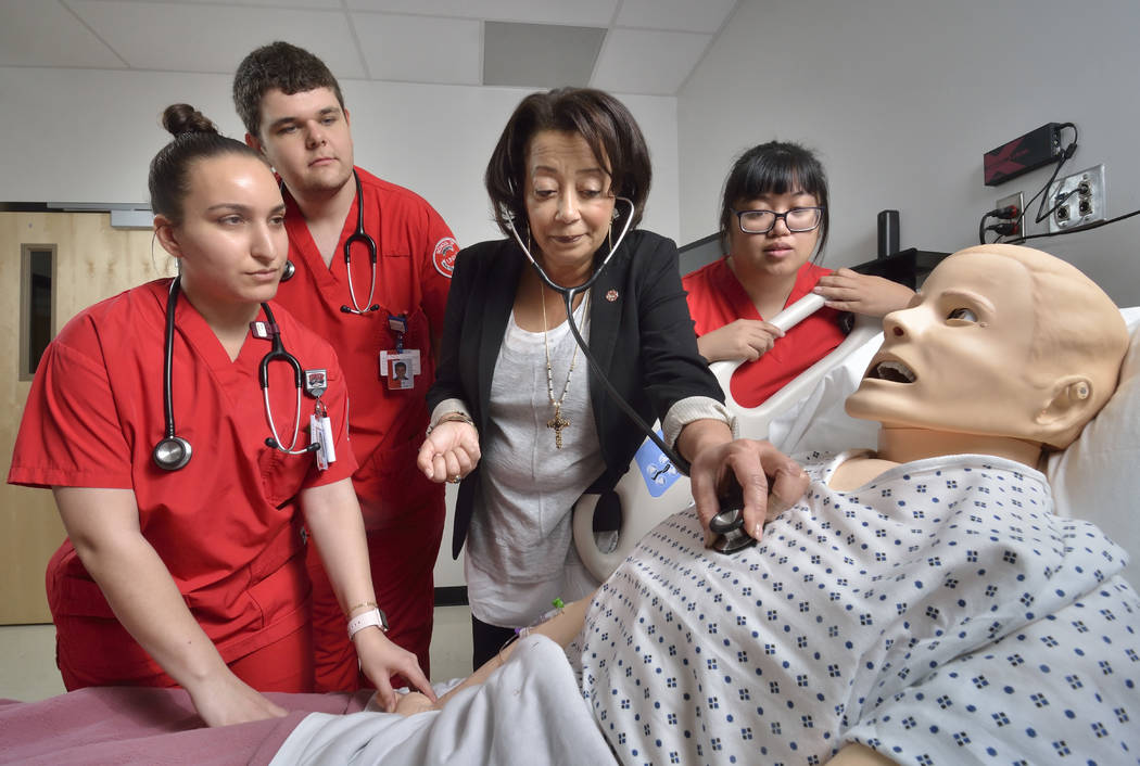 Angela Amar, dean of the UNLV School of Nursing, is shown with nursing students, from left, Ellen Sarkisian, Levi Gray and Fae Tahimick in the Clinical Simulation Center of Las Vegas at 1001 Shado ...