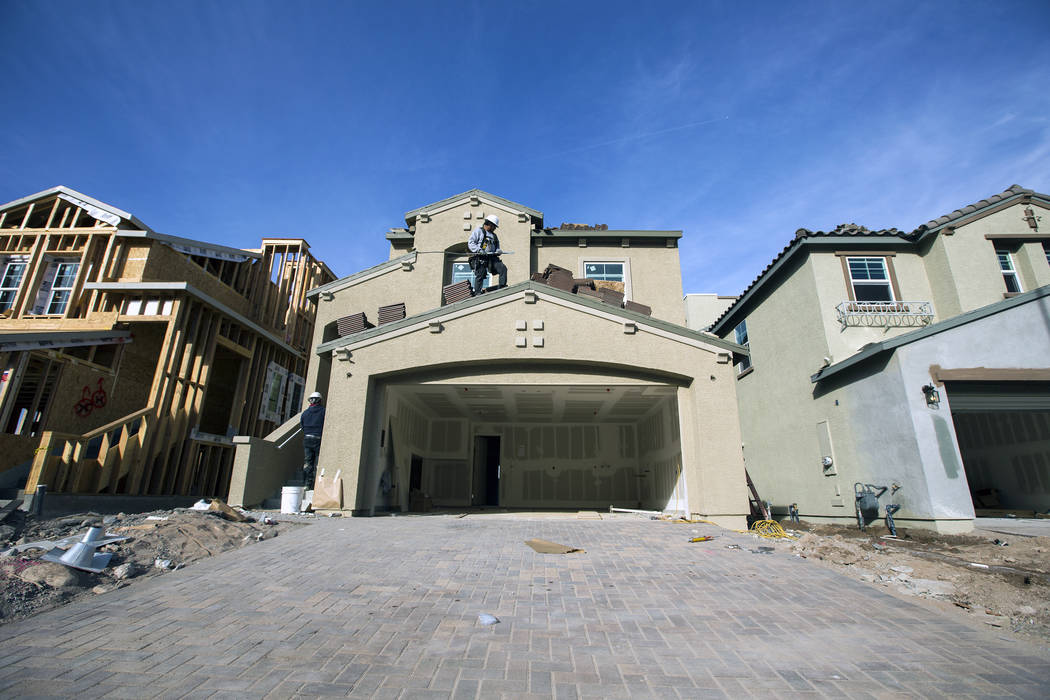 A man works on a single-family home at Cadence, a 2,300-acre master planned community, in Henderson in 2016. (Las Vegas Business Press File Photo)