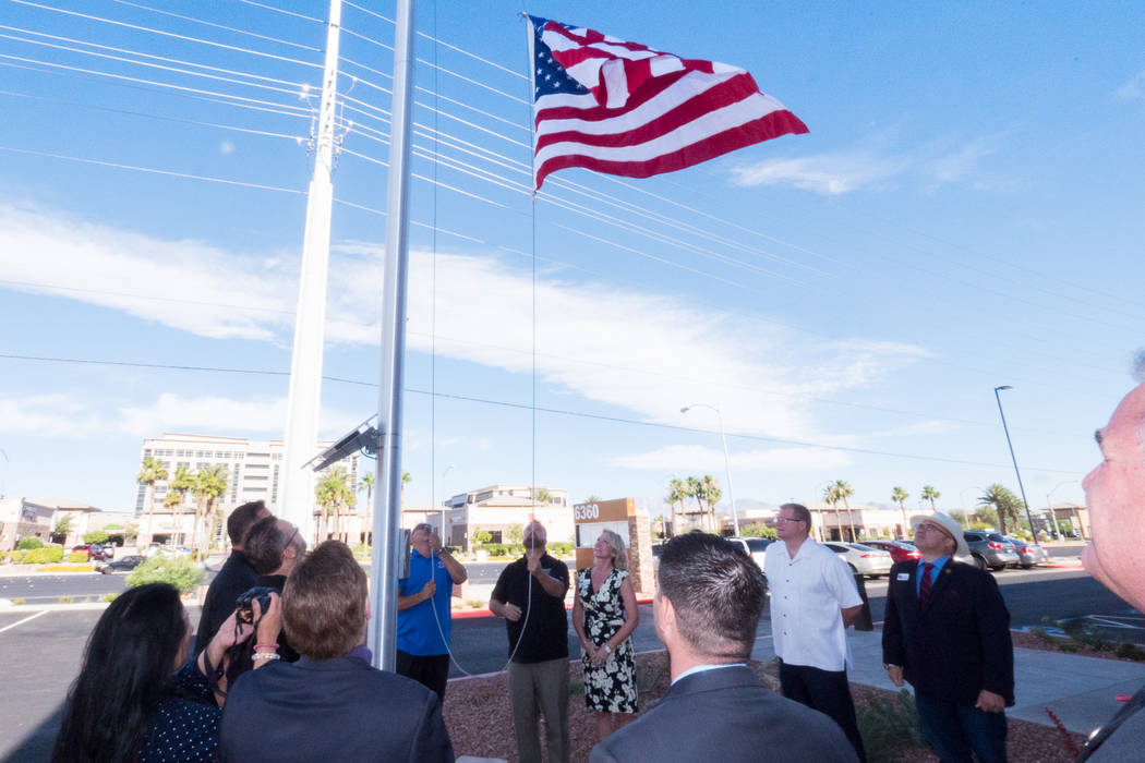 Members of the Greater Las Vegas Association of Realtors and Veterans Association of Real Estate Professionals President Ernie Gonzales gathered to raise the American flag for the first time over ...