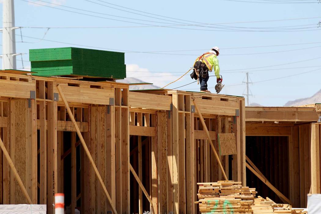 A crew works on a town home project. A report by Home Builders Research says Las Vegas homebuilders are building more attached home products to provide more affordable options. (K.M. Cannon RJNewH ...