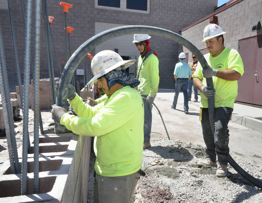 Workers pour concrete for a wall which is part of the expansion to the Mountain’s Edge Hospital Orthopedic Surgery Center. (Bill Hughes Las Vegas Business Press)
