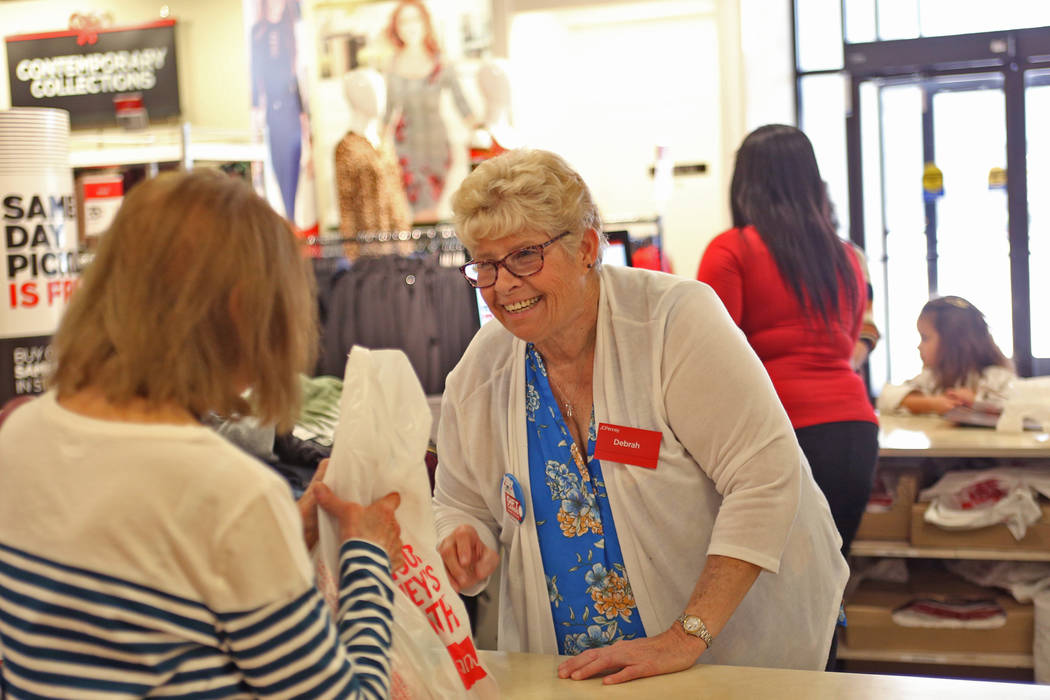 Seasonal worker Debrah Williams helps a customer at the J.C. Penney store at the Galleria at Sunset in Henderson on Nov. 19. (Rachel Aston/Las Vegas Business Press)