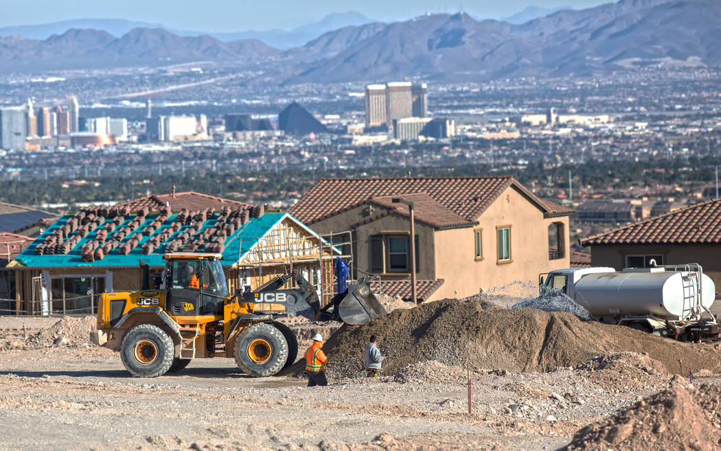 Construction workers prep the area south of The Paseos in Summerlin for new home construction on Feb. 28, 2017. (Benjamin Hager/Las Vegas Business Press)