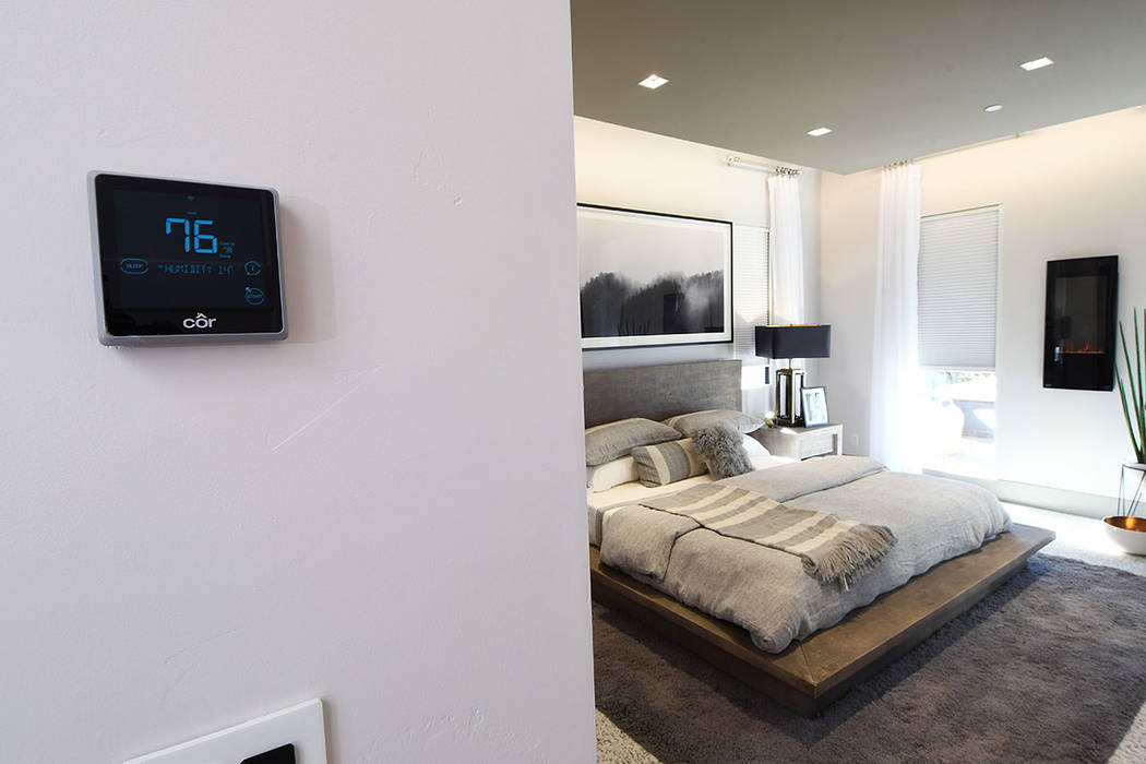 The Darwin circadian lighting system couples programmable LEDs with motorized window shades. (KB Home)