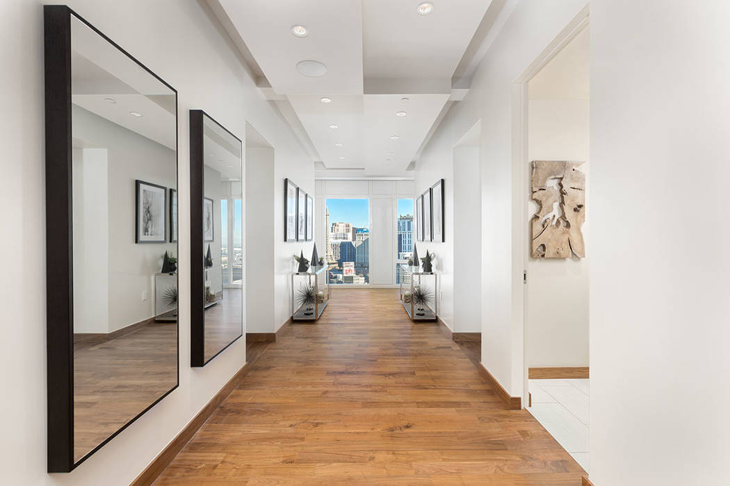 The hallway in Waldorf Astoria unit No. 2403 is lined with mirrors. (Luxury Estates International)