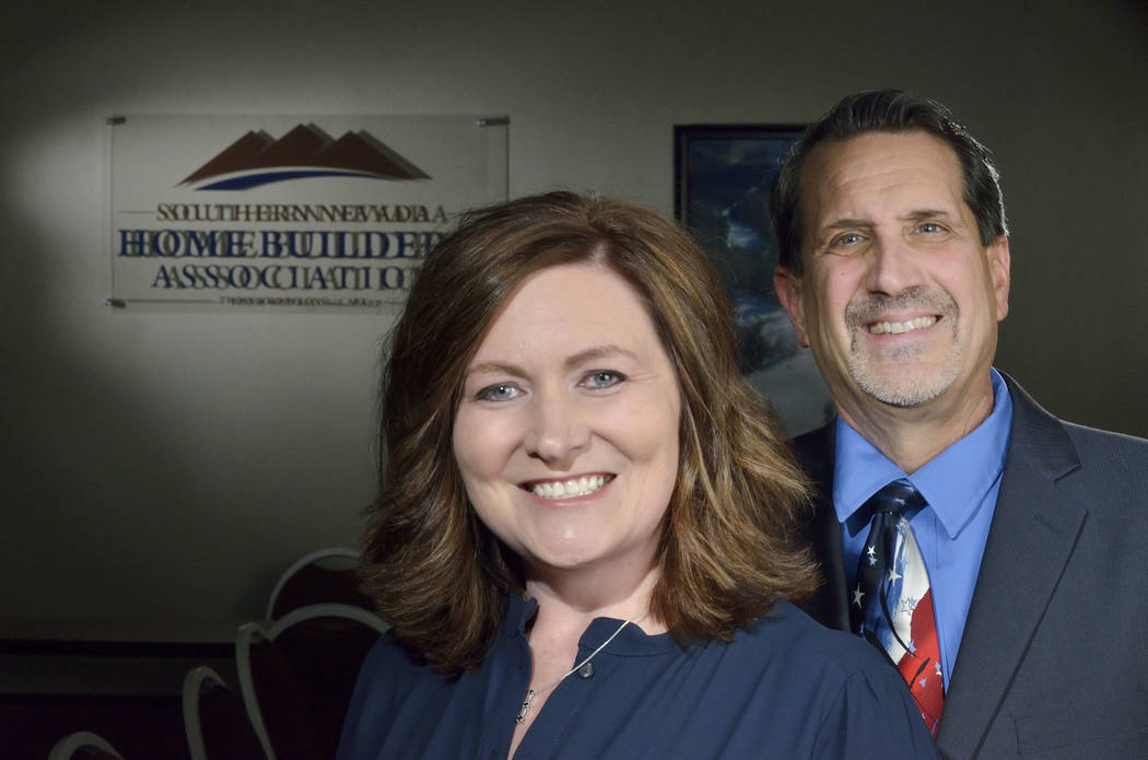 Janet Love, president of the Southern Nevada Homebuilders Association and of StoryBook Homes, and Nat Hodgson, CEO of SNHBA and executive director of HomeAid of Nevada, are shown at the SNHBA offi ...