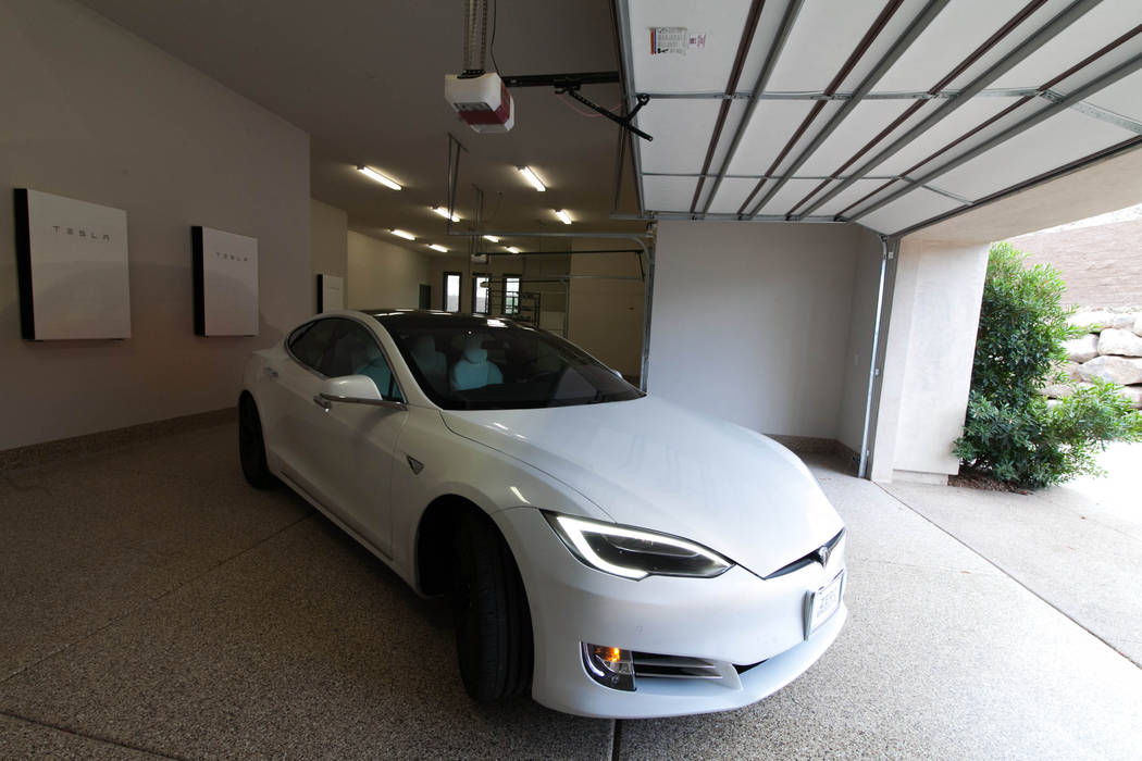 The six-car garage includes four integrated Tesla Powerwall 2 battery storage modules. (Growth ...