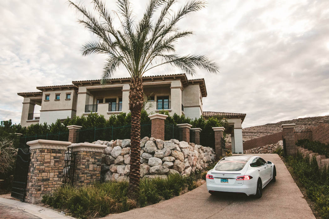 A Tesla comes with the home at 27 Shadow Canyon Court in Southern Highlands. (Growth Luxury Homes)