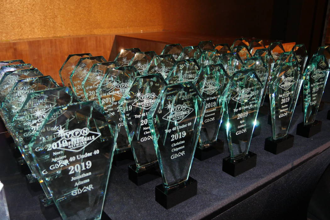 Trophies on display for the May 23 YPN Top 40 Under 40 event at the Vanity nightclub inside the ...