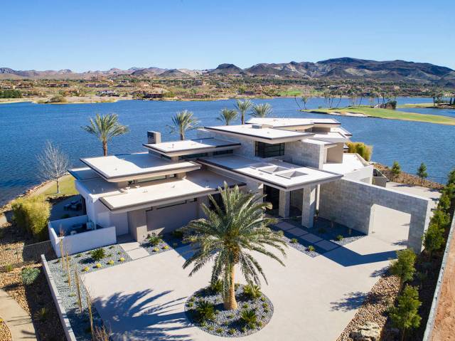 Sited on a 1.2-acre lot, the two-story, 8,838-square-foot desert-contemporary home is listed fo ...