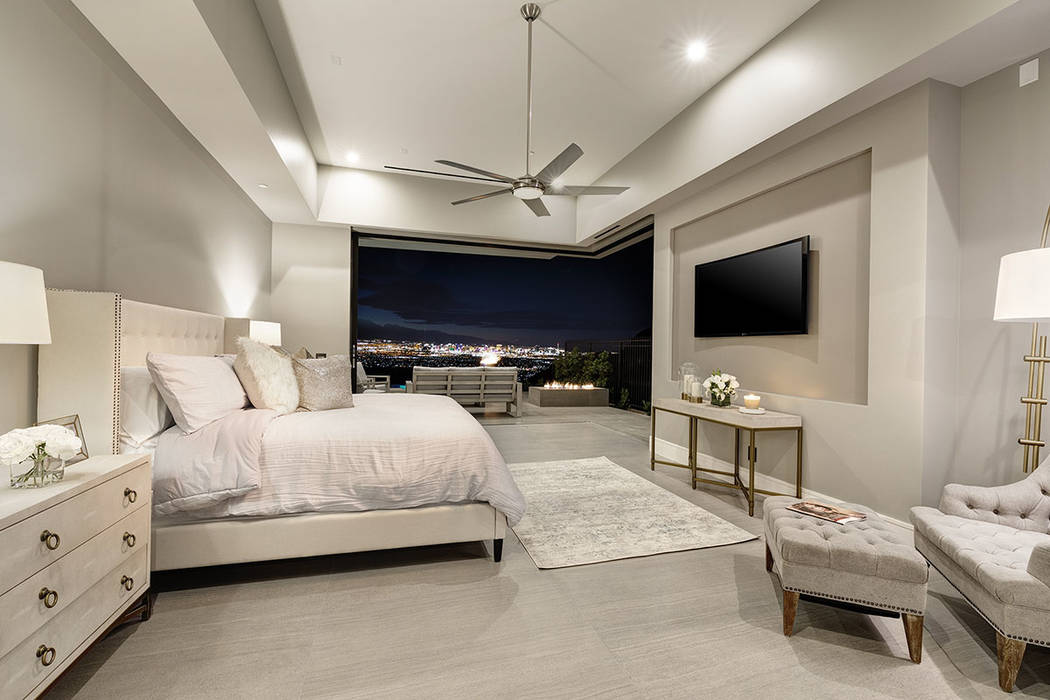 The master bedroom opens to a balcony with a fire feature and views of the Las Vegas Strip. (Sy ...
