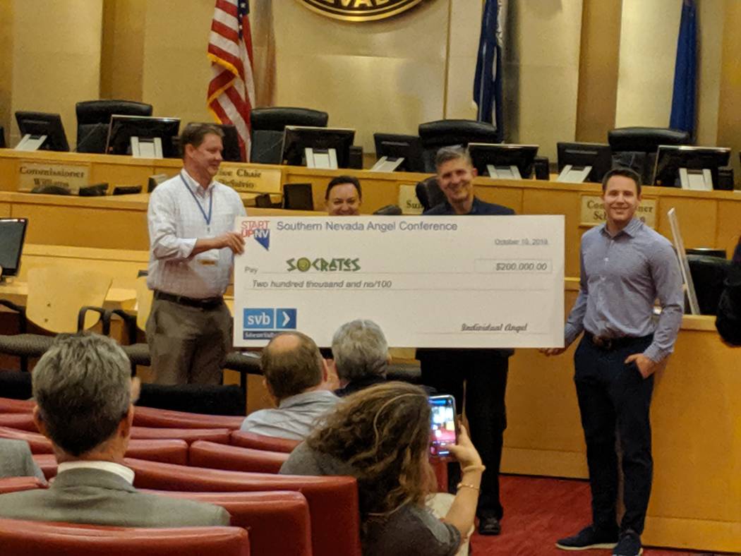 Socrates founder Brian Rosenberg receives check representing $20,000 at The Oct. 10 StartUpNV c ...