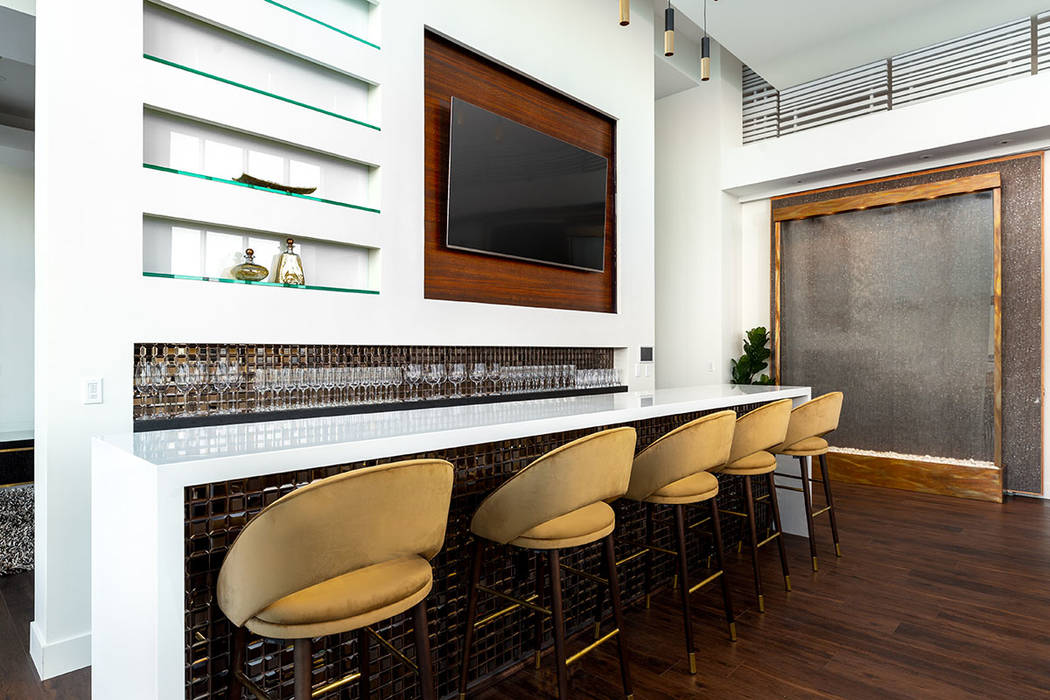 The bar is a centerpiece of the high-rise penthouse. (Turnkey Pads)
