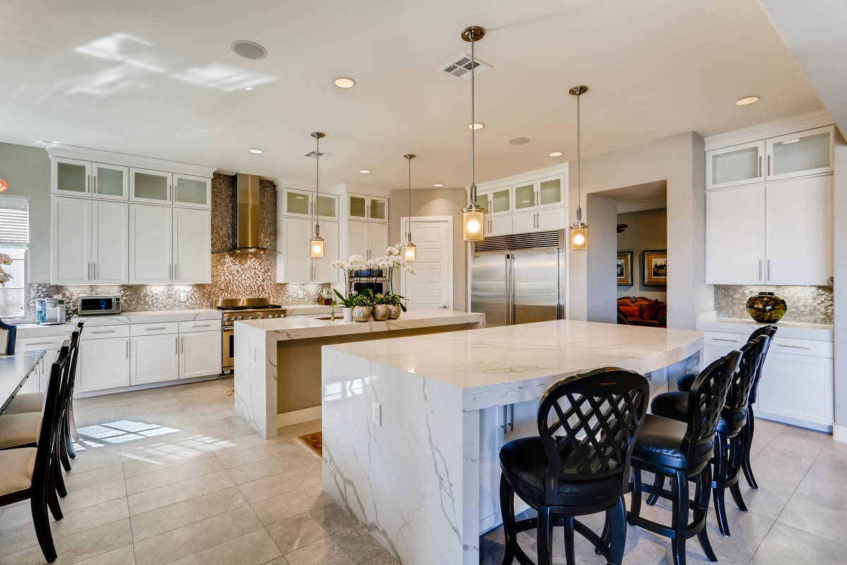 The kitchen has two large islands. (Realty One Group)