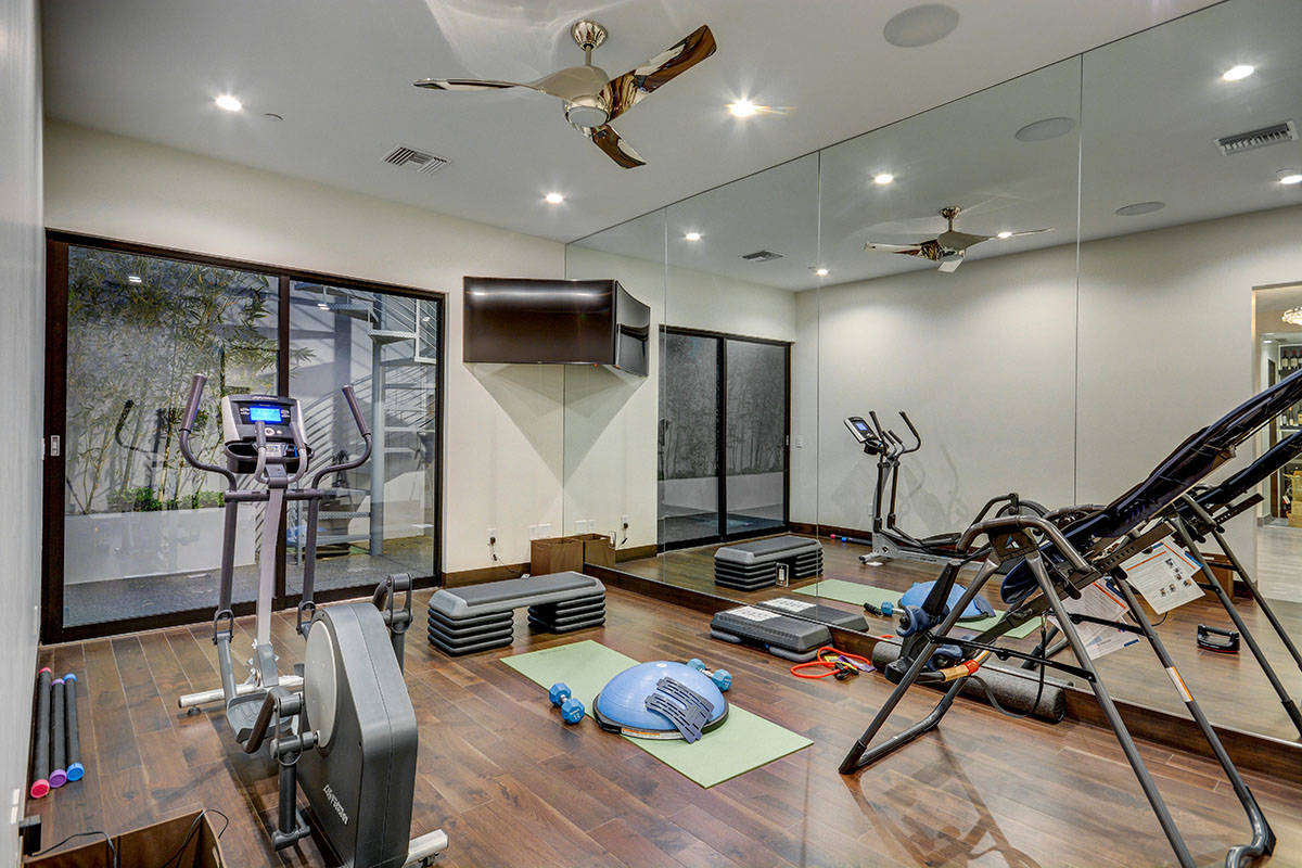 Local and regional design experts say that more luxury homes will include a home gym, like this ...