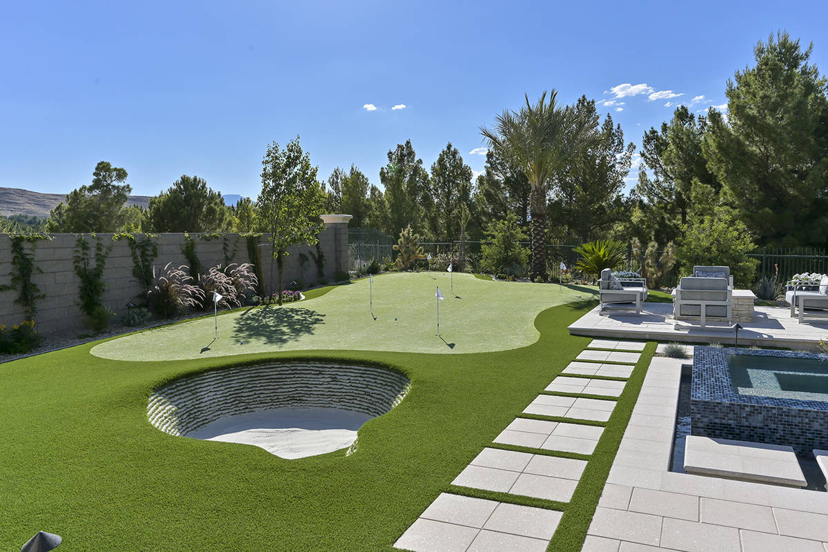 The backyard has a putting green and bunker. (Nartey/Wilner Group, Simply Vegas)