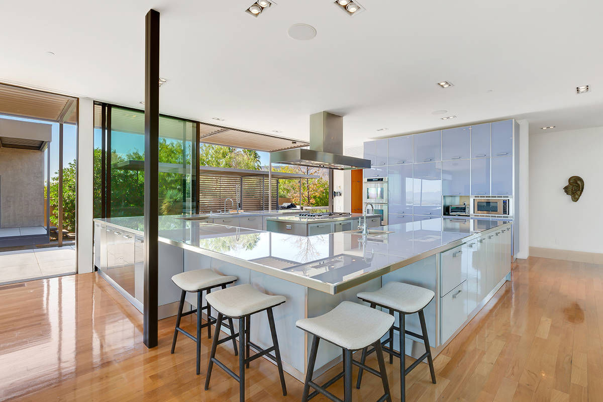 The home has a Scavolini luxury Italian kitchen surrounded by floor-to-ceiling windows. (Ivan S ...