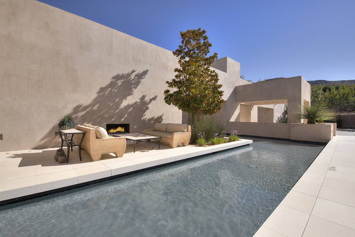 A water feature is at the front of the home. (Synergy Sotheby’s International Realty)