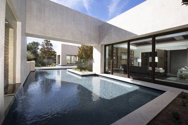 The office opens to the pool. (Synergy Sotheby’s International Realty)