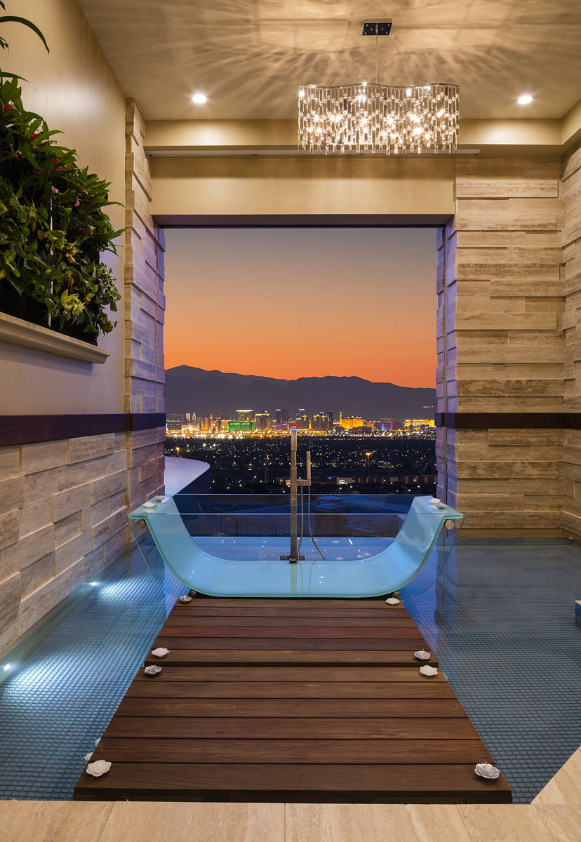 The Henderson home's master bedroom has a unique bath that has views of the Las Vegas Strip. (S ...