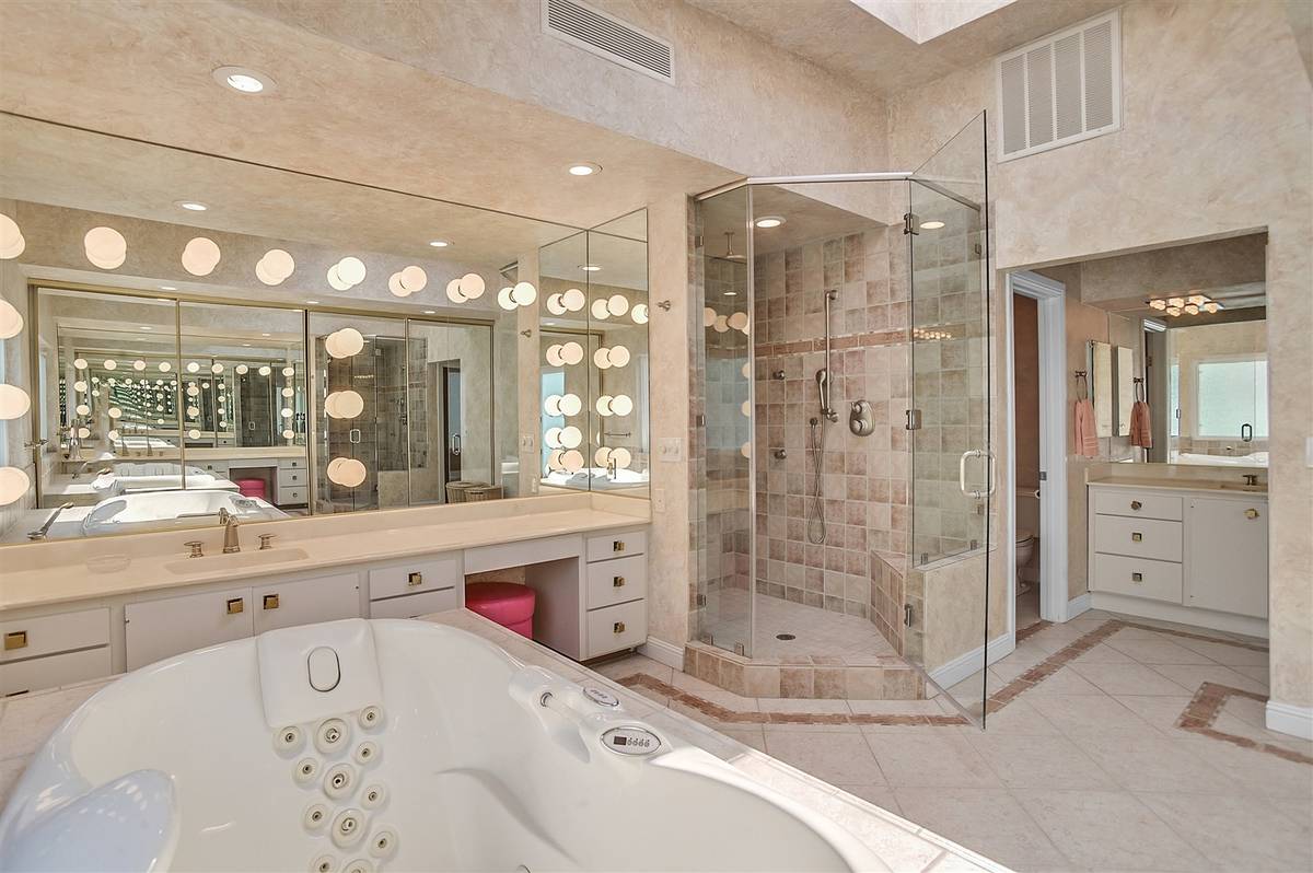 The master bath features a large shower and Jacuzzi tub that lights up and turns colors. (Narte ...