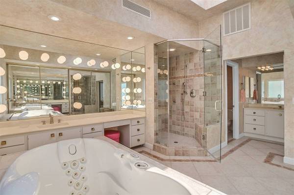 The master bath features a large shower and Jacuzzi tub that lights up and turns colors. (Narte ...