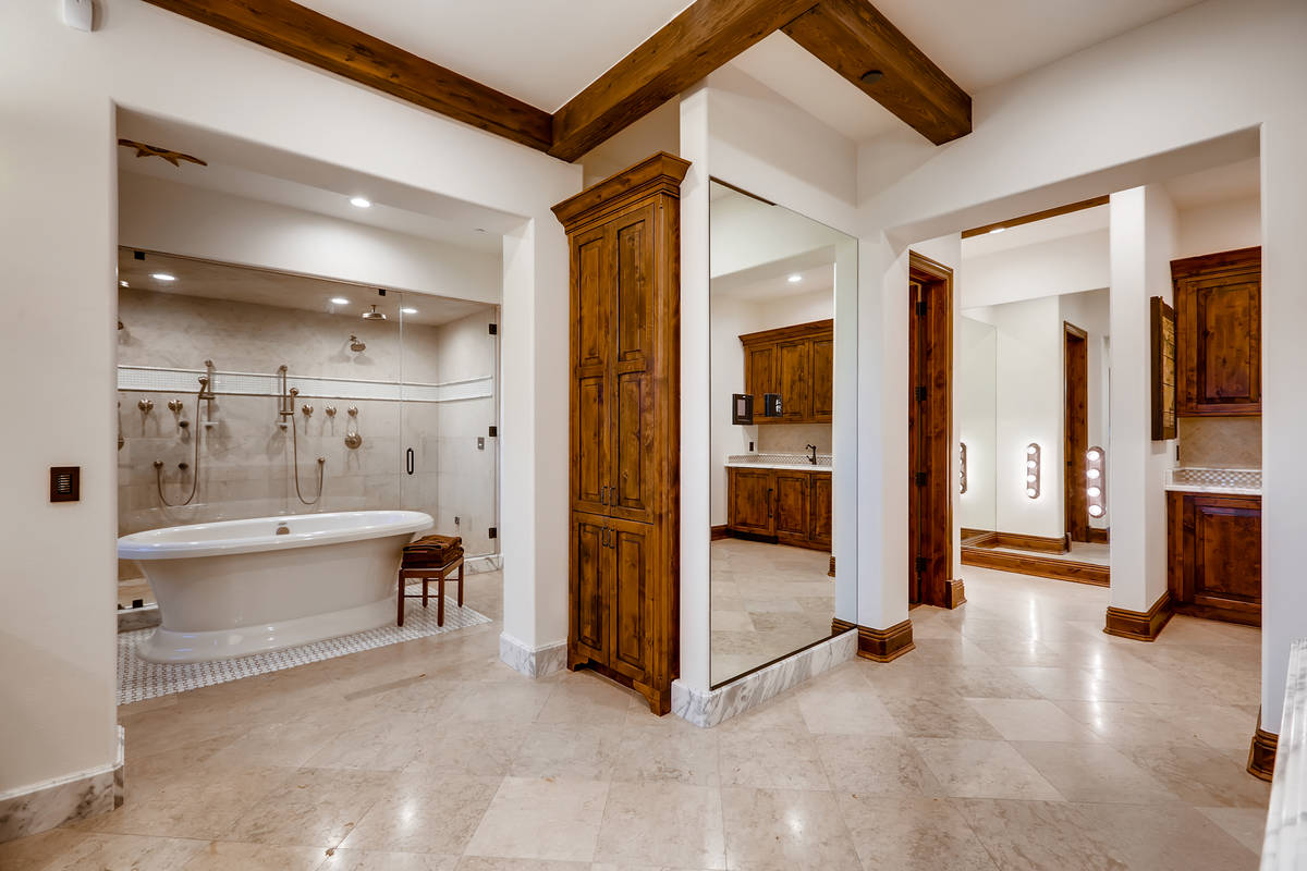 The large master bath has a large soaking tub that fills up from a tap in the ceiling. (The Cra ...