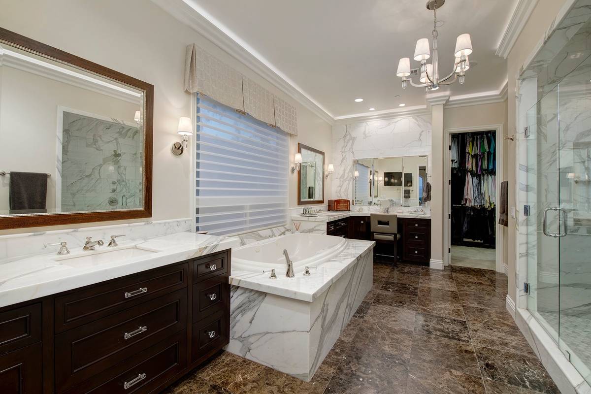 The master bath was remodeled and features spa-quality features and a soaking tub. (Synergy Sot ...