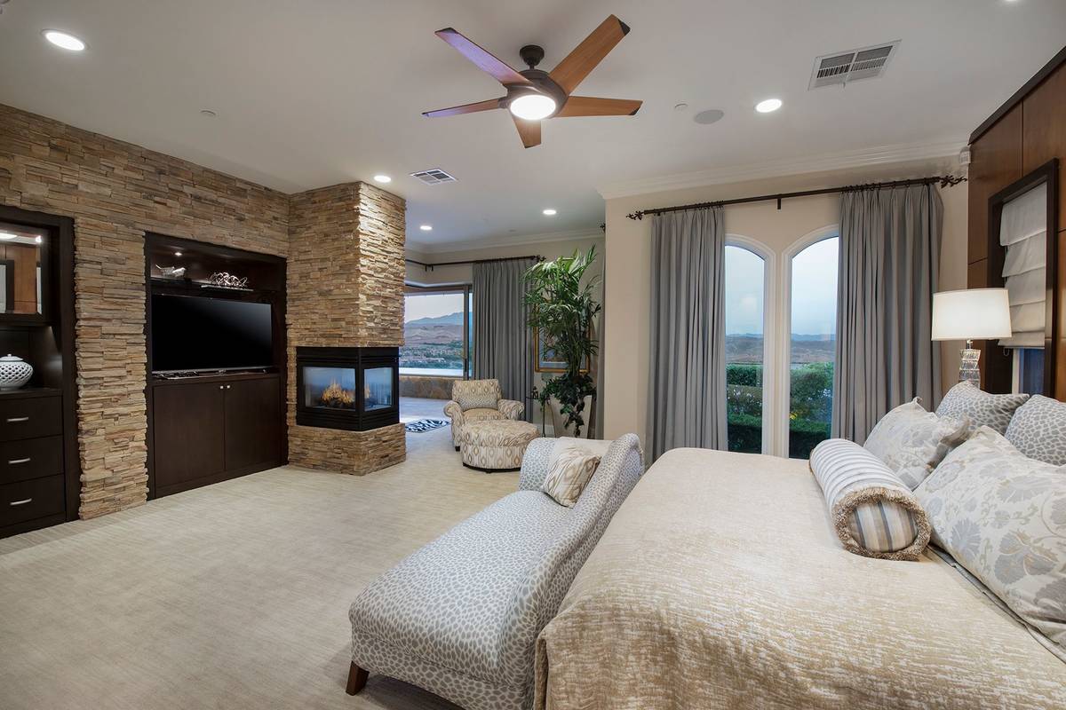 The remodeled master suite features a fireplace, lounge area and a balcony with views of the la ...