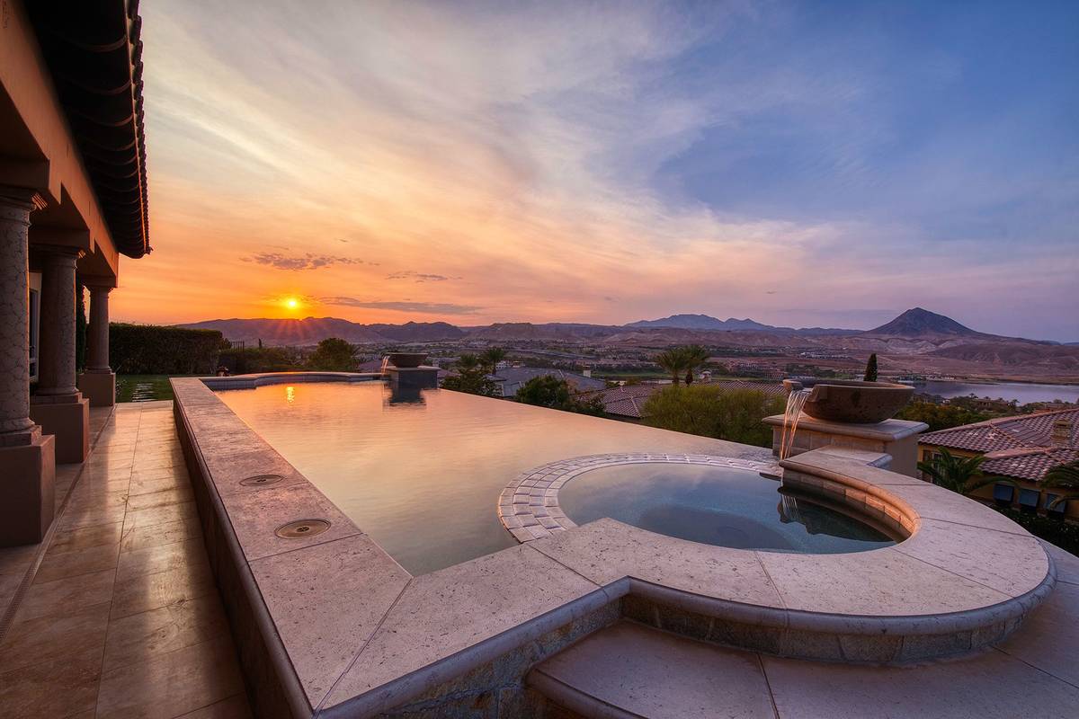 This Lake Las Vegas home has views of the desert mountains, golf course and the man-made lake. ...