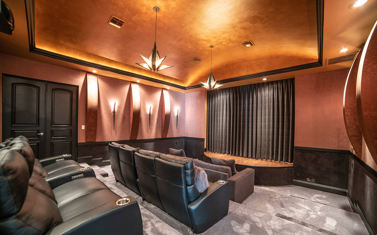 The movie theater is on the main level of the Queensridge home. That level also has a three-qua ...