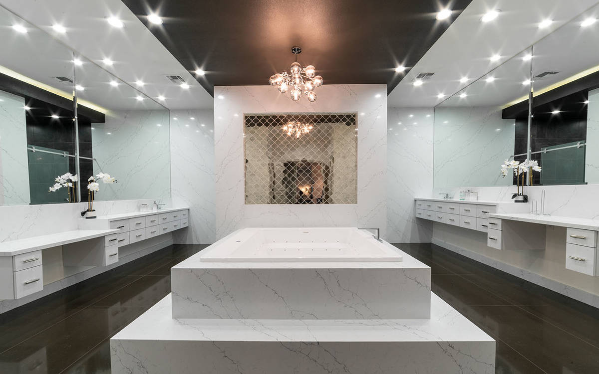 The master bath in the main master suite underwent an extensive renovation and now has spa-qual ...