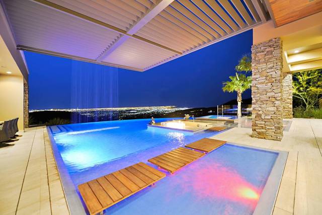 The MacDonald Highlands home has an infinity-edge pool and five-car garage and unobstructed vie ...