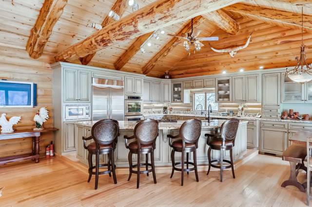 Mt. Charleston Realty The country-style kitchen is accentuated by a tongue-and-groove, cedar wo ...