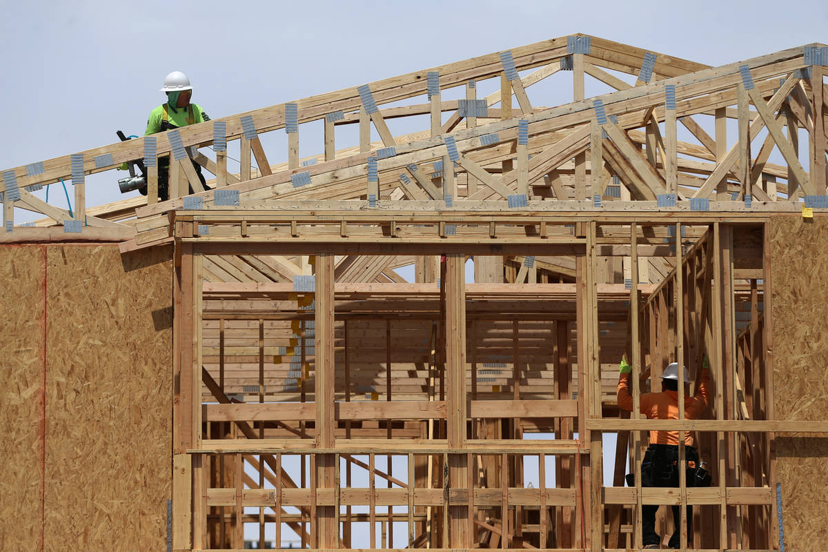 In April, construction workers are shown building a home in Skye Canyon, a master-planned commu ...