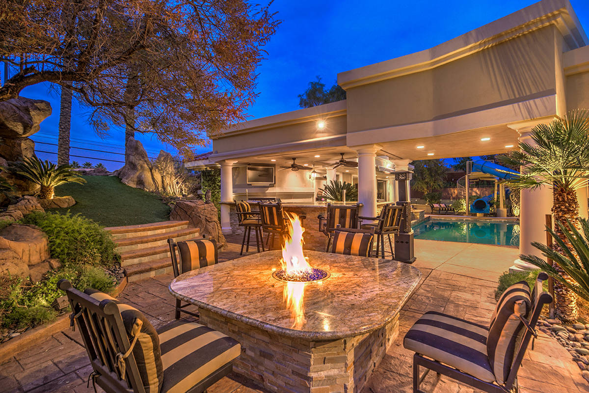 Patio has bar and fire pit table. (Mark Wiley Group)