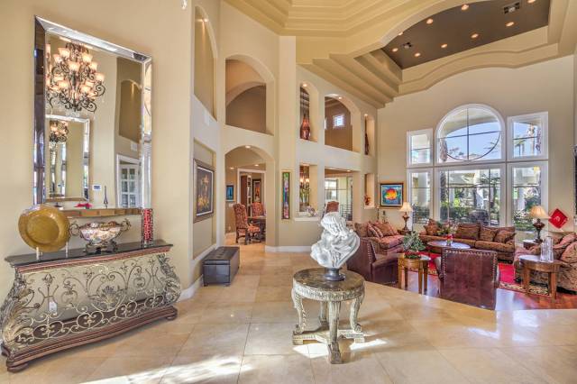 The six-bedroom, 10-bathroom, two-story Mediterranean-style home on the exterior measures 11,62 ...