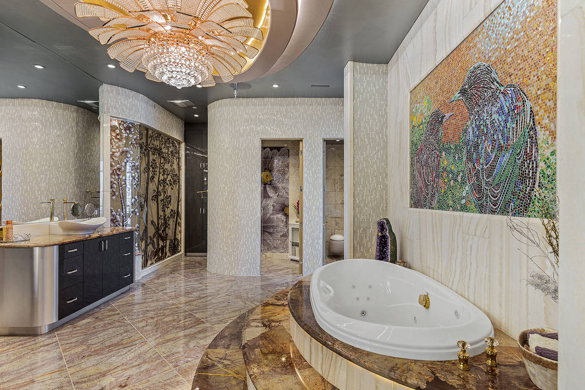 The opulent master bath features an oversized multi-jet, double-bench marble shower with 3D etc ...