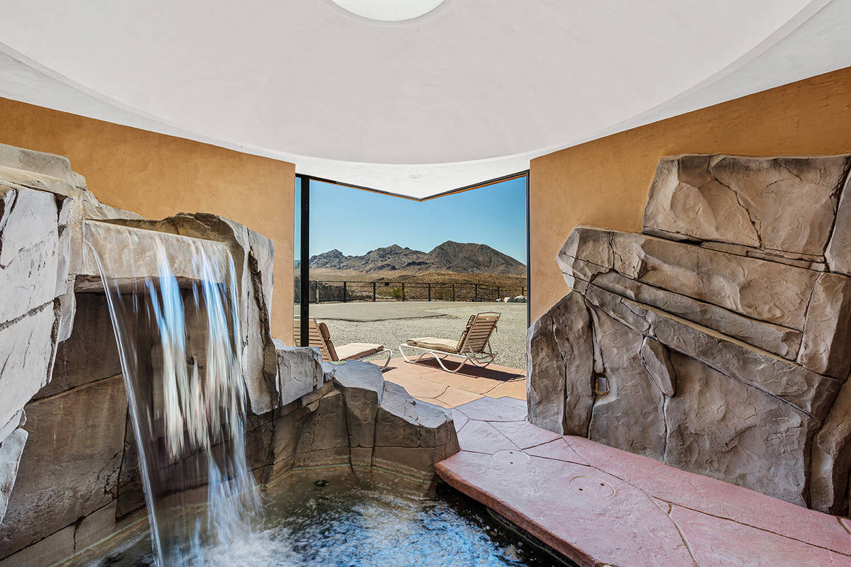 The master bedroom is on its own wing with the gym, office, library, sitting room and the grott ...