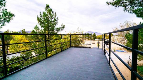Alternative Living Spaces Sally Lushin's 20-foot container tiny home has a rooftop deck.