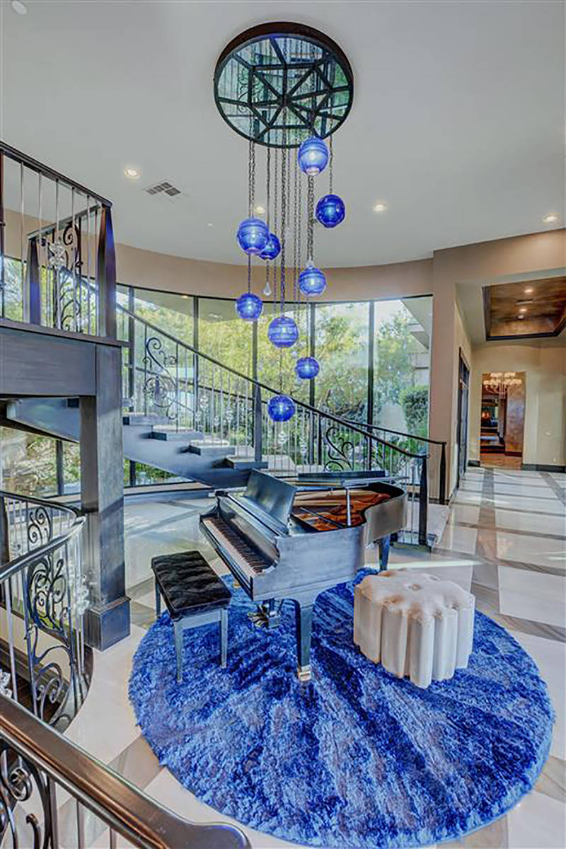 The home features a blue chandelier by Santangelo. (Keller Williams)
