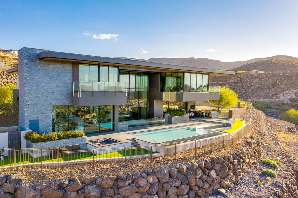 KISS rocker Gene Simmons paid $10.8 million for a modern-style home in the Henderson hillside l ...