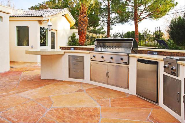 Outdoor kitchens are getting smaller but packed with more luxury and high-end features. (Ozzie ...