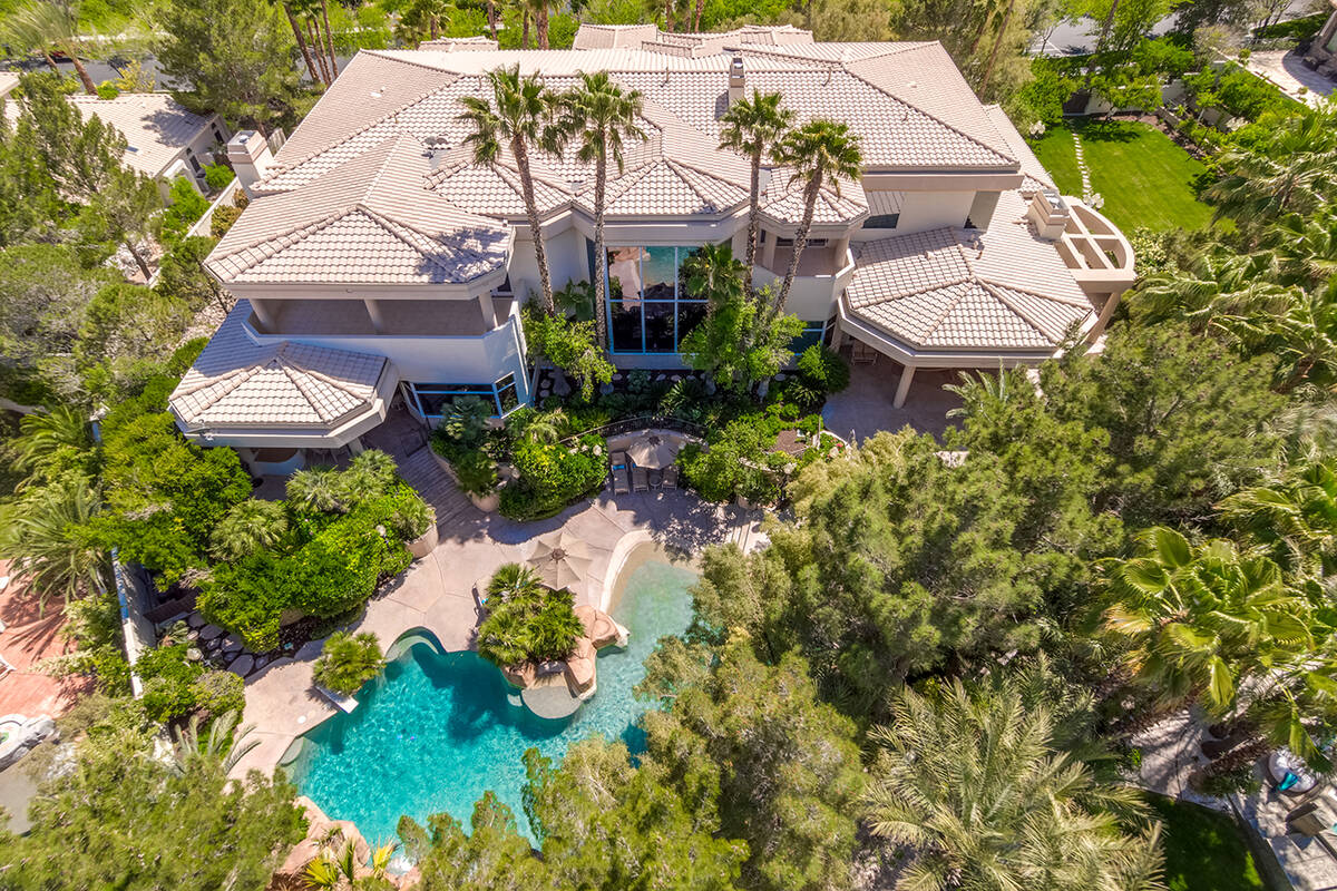 A mansion in Tournament Hills in Summerlin, 8912 Greensboro Lane, is listed for $13.9 million. ...