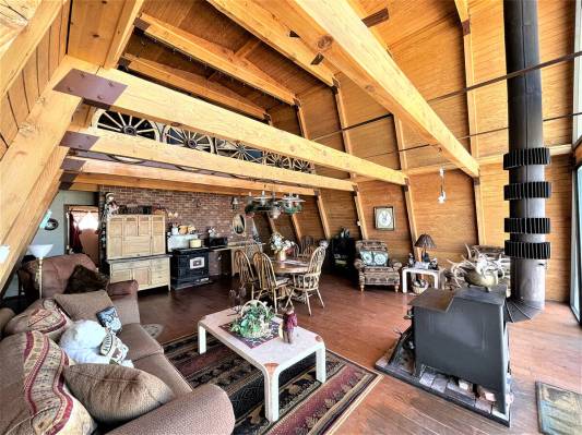 The 1,344-square-foot alpine-designed cabin is powered by a generator. A wood stove provides th ...